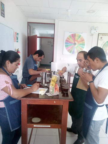 roasters tasting coffee at Sol Y Cafe in Peru